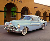 AUT 21 RK0643 02
1953 Buick Skylark Hardtop Light Blue 3/4 Side View On Pavement In Front Of Building Headlights On