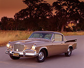 AUT 21 RK0655 03
1958 Studebaker Golden Hawk 3/4 Front View On Pavement Trees Filtered