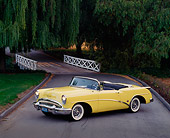 AUT 21 RK0668 05
1954 Buick Skylark Model 100 Convertible Yellow 3/4 Side View On Pavement