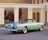 AUT 21 RK0722 08
1953 Packard Caribbean Convertible Green 3/4 Rear View On Pavement By Pillars