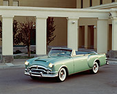 AUT 21 RK0724 02
1953 Packard Caribbean Green Convertible 3/4 Front View On Pavement By Pillars