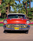 AUT 21 RK0773 02
1957 Chevy Bel Air Sport Coupe Red Head On Shot On Pavement By Palm Trees And Flowers Blue Sky