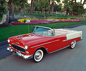 AUT 21 RK0776 01
1955 Chevrolet Bel Air Convertible Red Low 3/4 Side View On Pavement By Palm Trees