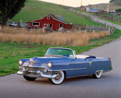 AUT 21 RK0783 13
1954 Cadillac Convertible Blue 3/4 Side View On Pavement By Barn