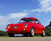 AUT 21 RK0784 01
1959 Abarth Zagato Double Bubble Coupe Red Low 3/4 Front View On Pavement Blue Sky