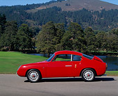 AUT 21 RK0788 01
1959 Abarth Zagato Double Bubble Coupe Red Side View On Pavement Grass And Trees Background