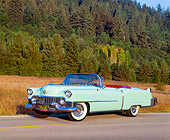 AUT 21 RK0810 07
1954 Cadillac Convertible Light Green 3/4 Side View On Road By Dry Grass And Trees
