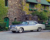 AUT 21 RK0898 06
1955 Chrysler New Yorker Blue And White 3/4 Side On Driveway In Front Of House Headlights On