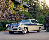 AUT 21 RK0899 07
1955 Chrysler New Yorker Blue And White 3/4 Front View On Driveway Headlights On