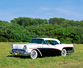 AUT 21 RK0912 01
1957 Buick Special Black And White 3/4 Side View On Grass By Trees Blue Sky