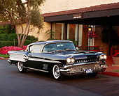 AUT 21 RK0928 03
1958 Pontiac Bonneville Black And White 3/4 Front View On Pavement Headlights On By Building