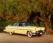 AUT 21 RK0942 03
1954 Mercury Monterey Sun Valley Yellow 3/4 Front View On Dirt By Trees And Water