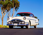 AUT 21 RK0948 02
1954 Packard Pacific Red And White Low 3/4 Front View On Road