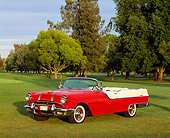 AUT 21 RK0954 08
1955 Pontiac Star Chief Convertible Red And White Side 3/4 View On Grass By Trees