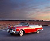 AUT 21 RK0958 01
1955 Pontiac Star Chief Convertible Red And White Side 3/4 View On Pavement Pink Clouds At Dusk