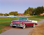 AUT 21 RK0971 06
1956 Chevrolet Bel Air Convertible Burgundy 3/4 Front View On Pavement Parking Lights On By Grass And Trees