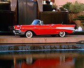 AUT 21 RK1061 07
1957 Chevy Bel Air Convertible Red 3/4 Side View By Water Fountain