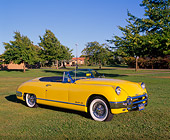 AUT 21 RK1073 02
1950 Muntz Jet Convertible Cadillac Powered Yellow 3/4 Side View On Grass Trees Blue Sky