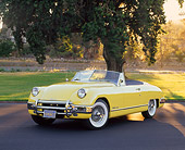 AUT 21 RK1076 01
1950 Muntz Jet Convertible Cadillac Powered Yellow 3/4 Front View On Pavement By Grass And Tree
