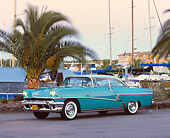 AUT 21 RK1086 03
1956 Mercury Monterey Hardtop Green 3/4 Side View On Pavement By Boat Harbor