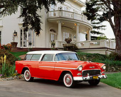 AUT 21 RK1092 05
1955 Chevy Nomad Wagon Red White Top 3/4 Side View On Driveway By House