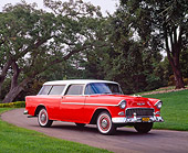 AUT 21 RK1099 02
1955 Chevy Nomad Wagon Red White Top 3/4 Front View On Pavement By Trees And Grass