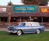 AUT 21 RK1105 01
1955 Chevrolet Nomad Wagon Glacier Blue 3/4 Side View On Grass By Store