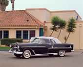 AUT 21 RK1118 01
1955 Chevy Bel Air Convertible Black 3/4 Side View On Pavement By Building
