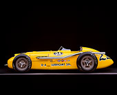 AUT 21 RK1125 03
1953 Kurtis 500B Indy Roadster Yellow Profile On Gray Line Studio