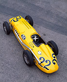AUT 21 RK1131 05
1953 Kurtis 500B Indy Roadster Yellow Overhead 3/4 Front View On Pavement