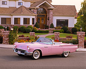 AUT 21 RK1155 06
1957 Ford Thunderbird Convertible Pink 3/4 Side View On Pavement By House