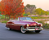 AUT 21 RK1166 01
1950 Mercury Convertible Dark Red 3/4 Front View On Pavement By Fall Trees And Water