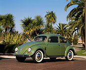 AUT 21 RK1205 04
1952 VW Bug Split Window Green 3/4 Front View On Pavement By Palm Trees Blue Sky