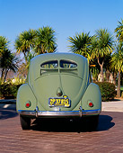 AUT 21 RK1208 02
1952 VW Bug Split Window Green 3/4 Rear View On Pavement By Palm Trees Blue Sky