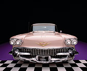 AUT 21 RK1212 01
Wide Angle Shot Of A 1958 Cadillac De Ville Sedan Pink Head On Shot Checkerboard And Purple Floor