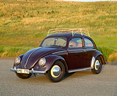 AUT 21 RK1282 02
1950 VW Split Window Bug Wine Red 3/4 Front View On Pavement By Grass Hill