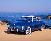 AUT 21 RK1376 02
1959 Karmann Ghia Coupe Blue And White 3/4 Front View On Sand
