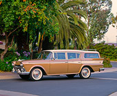 AUT 21 RK1398 02
1959 AMC Rambler Custom Cross Country Wagon Gold And White 3/4 Front View On Pavement By Trees