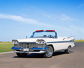 AUT 21 RK1422 02
1959 Plymouth Sport Fury Convertible White Low 3/4 Front View On Pavement Blue Sky
