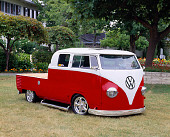 AUT 21 RK1425 03
1959 VW Crew Cab Bus Red And White 3/4 Front View On Grass By Trees