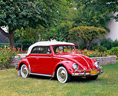AUT 21 RK1427 03
1956 VW Convertible Bug Red White Top 3/4 Side View On Grass By Flowers And Trees