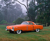 AUT 21 RK1438 02
1955 Boano Indy Lincoln Chasis Orange Prototype 3/4 Side View On Grass By Trees Foggy