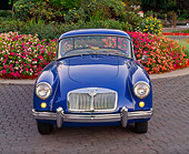 AUT 21 RK1466 01
1958 MGA Coupe Blue Head On Shot On Pavement By Flowers