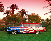 AUT 21 RK1471 02
1957 Chevy 210 Wagon American Flag Graphics Side View On Grass By Trees Pink Sky