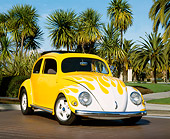 AUT 21 RK1492 04
1956 Volkswagen Beetle  Yellow With Flames Low 3/4 Front View By Palm Trees