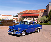 AUT 21 RK1536 03
1954 Chevrolet Bel Air Blue White Top 3/4 Front View By Water Fountain