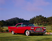 AUT 21 RK1540 02
1957 Chrysler 300C Red 3/4 Front View On Grass By Trees Blue Sky