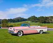 AUT 21 RK1546 02
1956 Desoto Firedome Convertible Pink 3/4 Side View On Grass Blue Sky