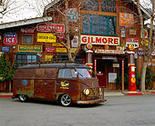 AUT 21 RK1607 02
1954 Volkswagen Panel Bus Rusted 3/4 Front View On Pavement By Antique Store