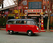 AUT 21 RK1614 02
1953 Volkswagen Deluxe Microbus Model 241 Red And Black 3/4 Front View On Pavement By Antique Store
